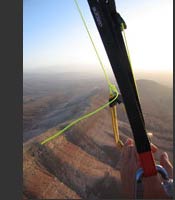 Thermalling paraglider above aitourir, Morocco